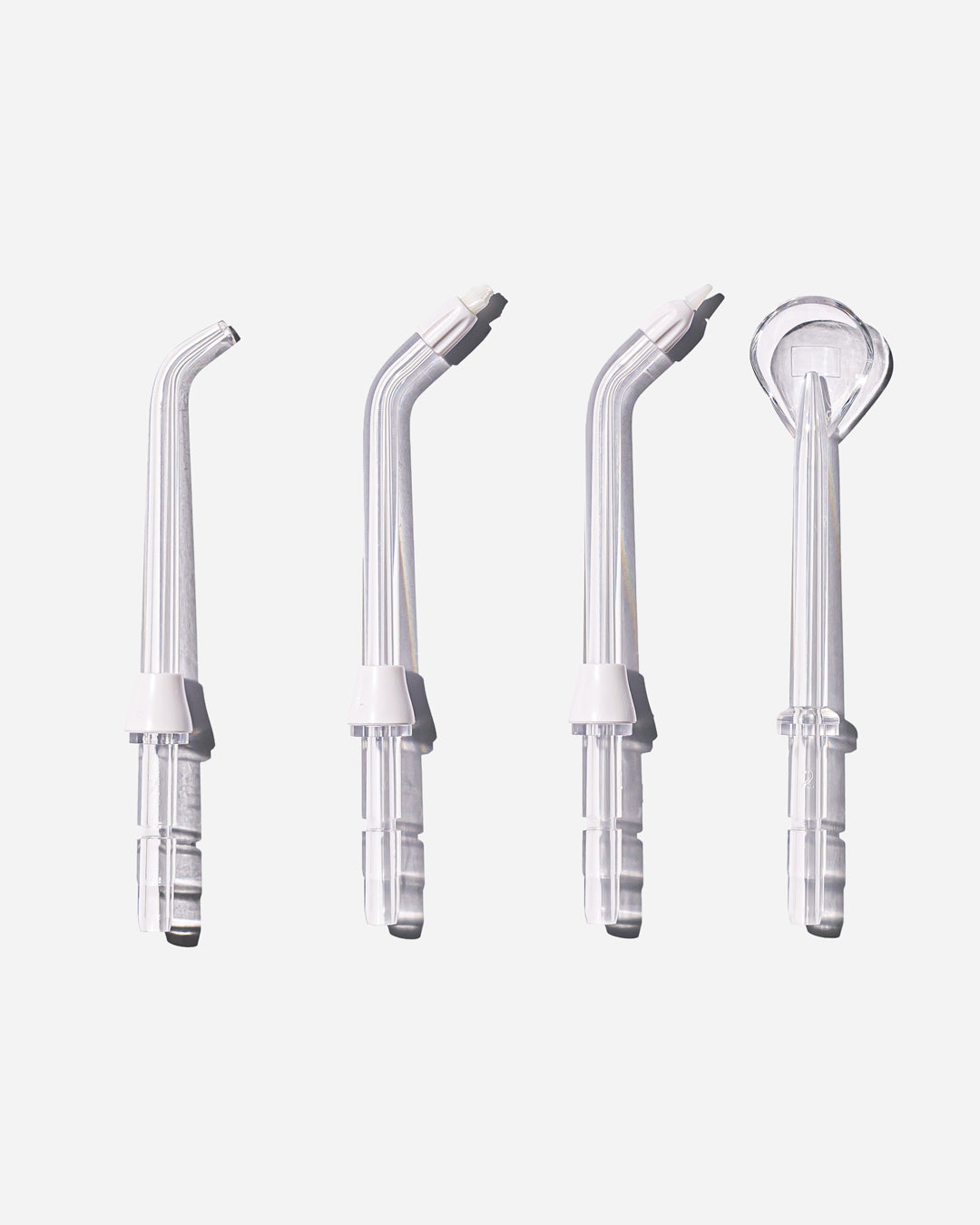 Spotlight Oral Care Water Flosser Replacement Tips set including Classic Jet Tip, Orthodontic Spray Tip, Periodontal Pocket Sprinkler, and Tongue Scraper for comprehensive oral hygiene