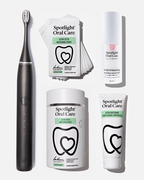 Spotlight Oral Care Sonic Pro Starter Bundle in Jet Black featuring electric toothbrush, whitening strips, accelerator gel, and professional toothpaste​