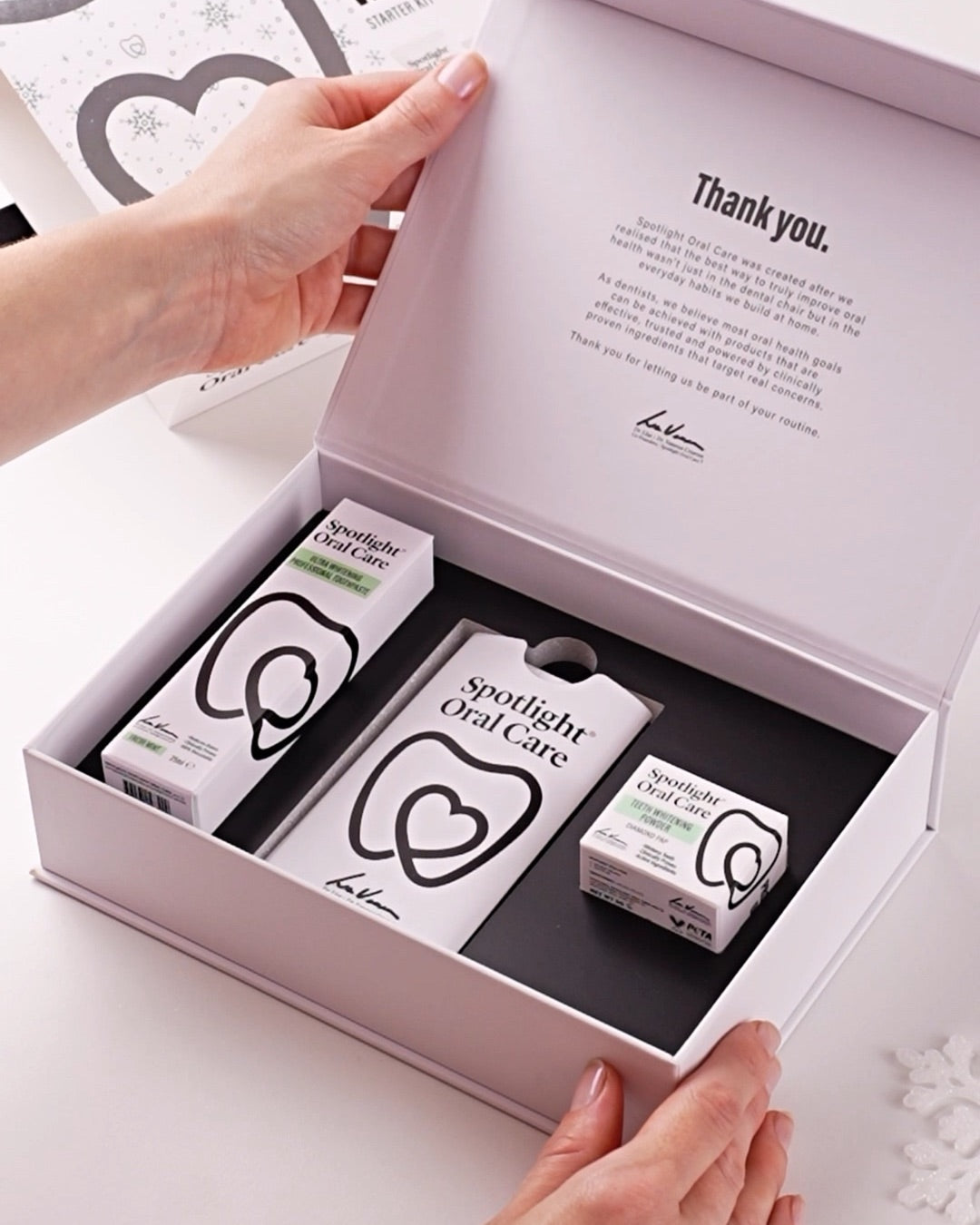 Whitening Starter Kit open gift box with strips, toothpaste and powder